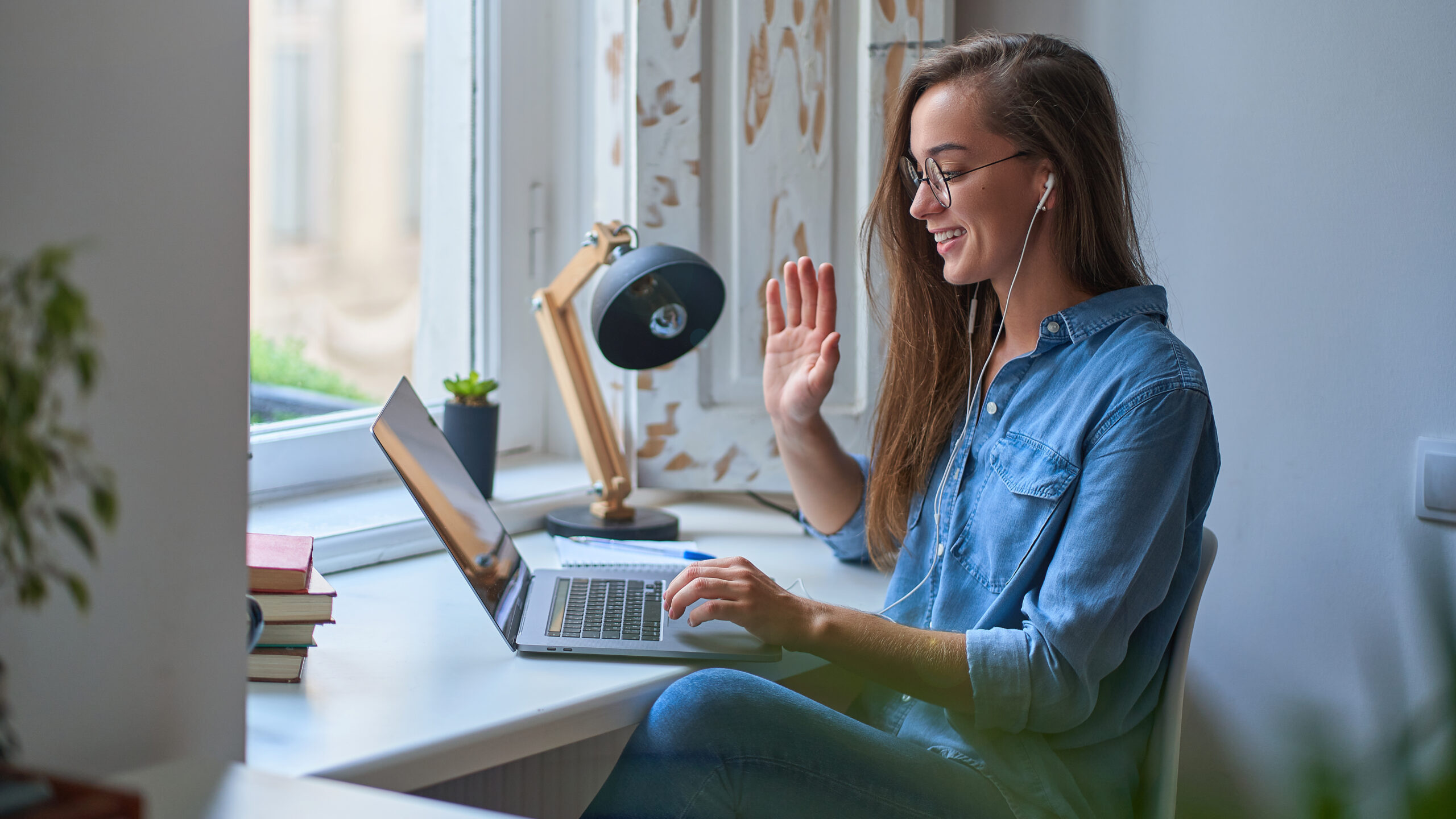 Happy smiling smart modern woman in headphones wearing shirt and